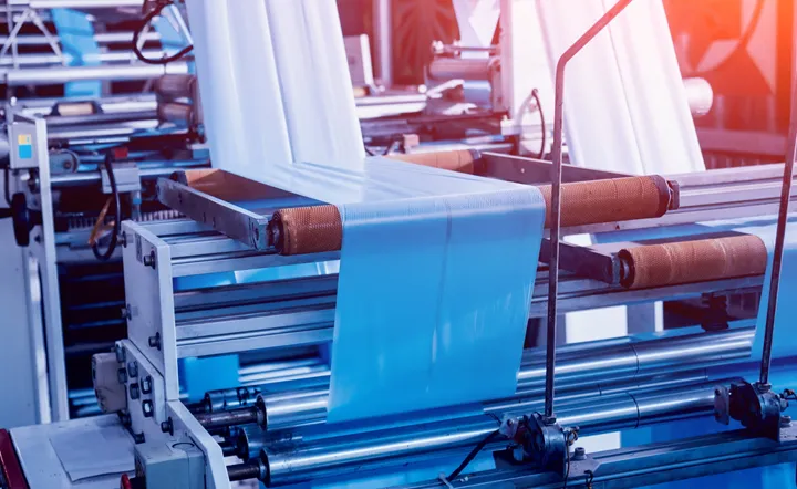 <p>Modern automated production line in factory. Plastic bag manufacturing process. Background</p>

